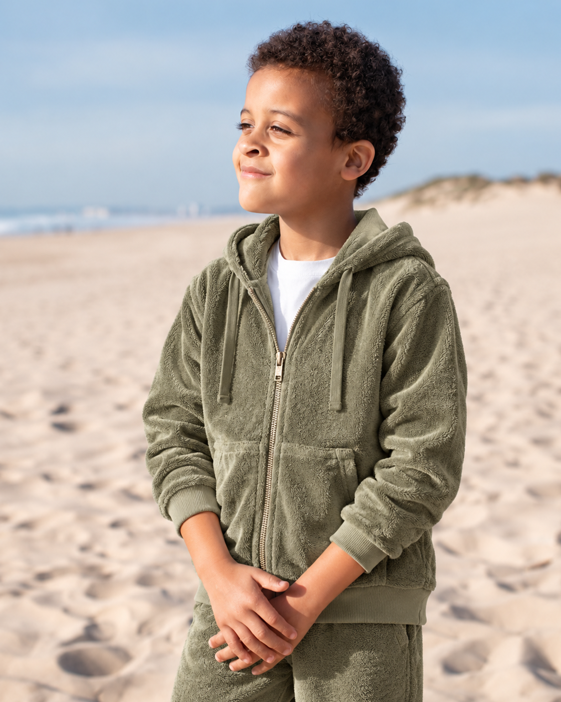 A child at the water's edge